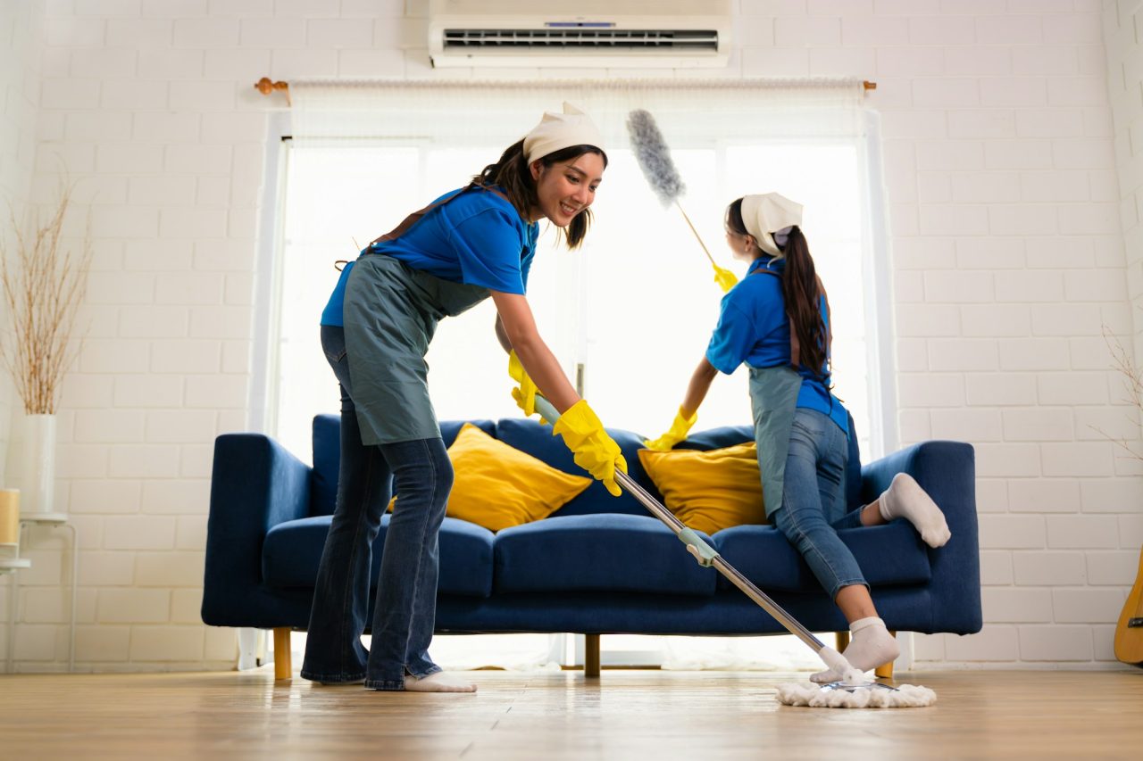 Couple of housekeeping staff cleaning house, Housekeeping and cleaning service, People doing